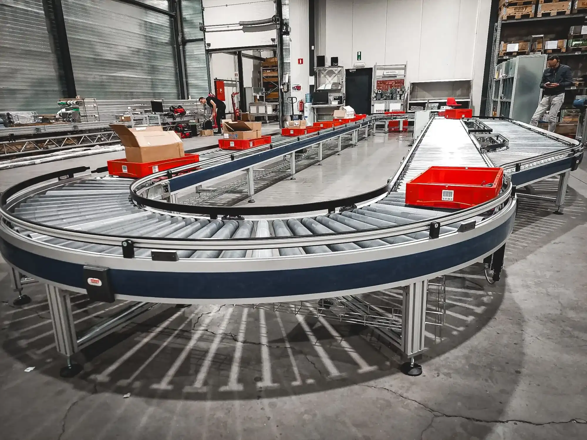 What is the definition of a conveyor?